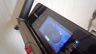 Mz24 - a Girl Bound to a Treadmill with Metal Restraints and Shackles