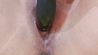 Horny asian teen fucks herself with a dildo