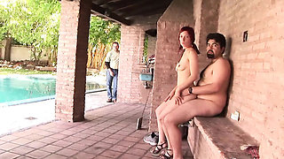 Redhead teen gets fucked by two men outside