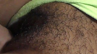 Close-up of a black hairy cunt filled with hot jizz