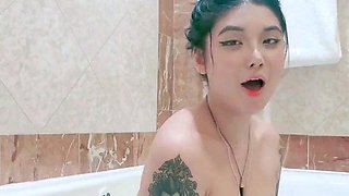 Busty babe playing with her big boobs