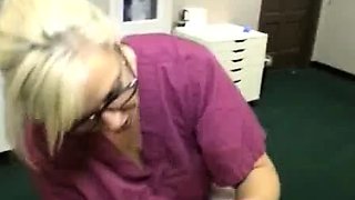 Milf Carey Riley strokes a young guys dick in the office