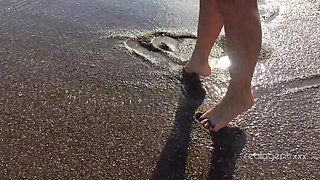 Alone lush Russian babe toys her cunt on the rock on the sea shore
